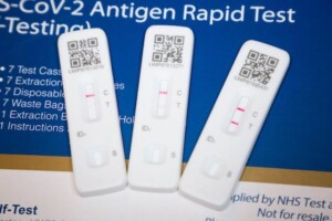 Two positive Covid test results and a single negative test result.